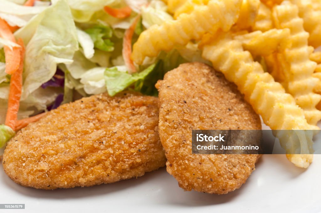 Breaded Chicken Breastsalad, and French Fries Close up