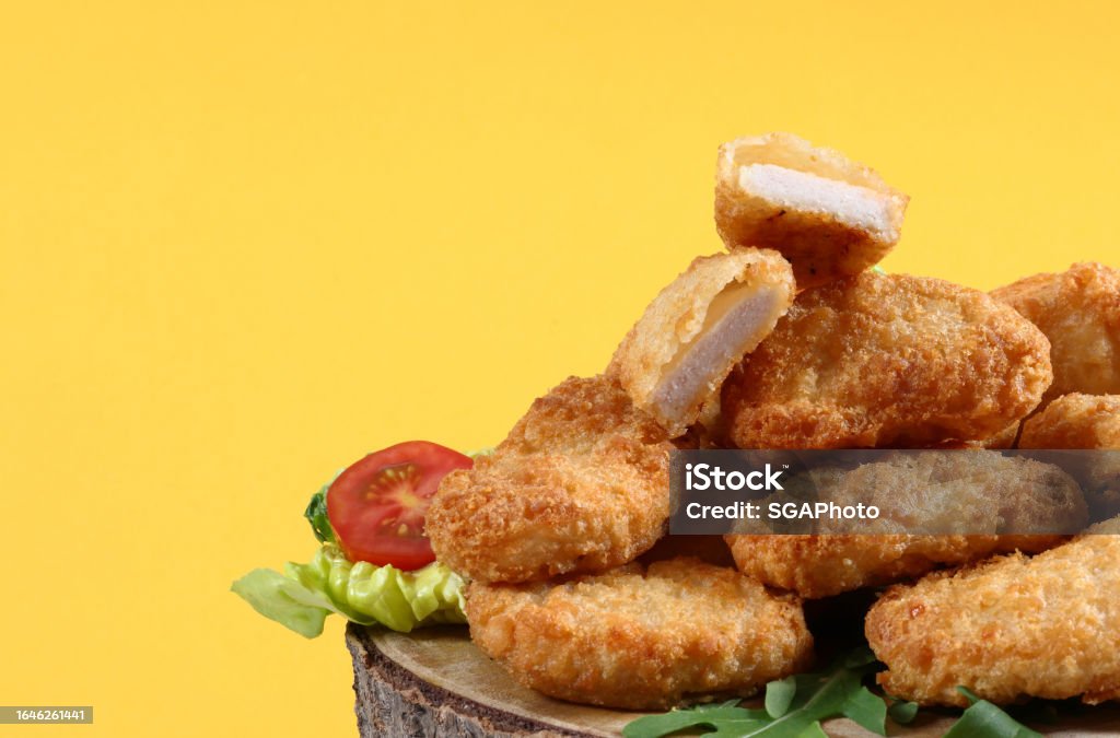 Chicken nuggets on yellow background